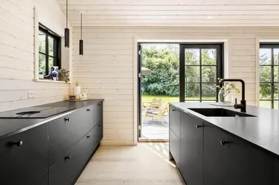 a kitchen with a black counter top and a sink at JB330-Fjerritslev-Perikumvej-12 in Fjerritslev