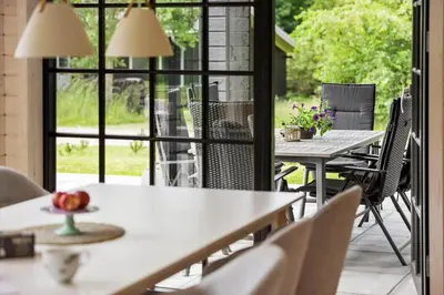 an outdoor patio with tables and chairs and a window at JB330-Fjerritslev-Perikumvej-12 in Fjerritslev