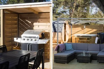 a patio with a couch and a grill and a table at JB195-Fjerritslev-Bogevej-36 in Fjerritslev