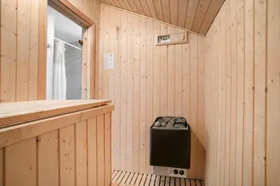 a sauna with a trash can in the corner at JB228-Brovst-Ildervej-14 in Brovst