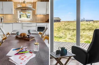 a kitchen with a table and a dining room at JB230-Frostrup-Grabakkevej-4 in Frøstrup