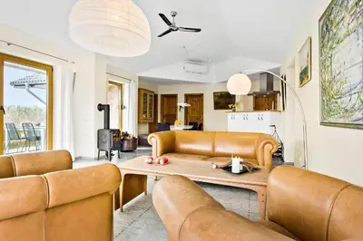 a living room with a couch and a table at JB227-Frostrup-Andreas-Lassens-Vej-16 in Frøstrup
