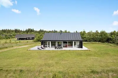 a house on top of a grassy field at JB359-Brovst-Kronvildtvej-242 in Brovst
