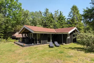 a pavilion with two chairs in a yard at JB353-Brovst-Hjortevaenget-13 in Brovst