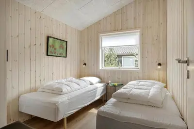 a bedroom with two beds and a window at JB351-Fjerritslev-Revlingestien-77 in Fjerritslev