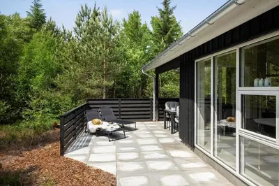 a screened in porch of a house with a patio at JB351-Fjerritslev-Revlingestien-77 in Fjerritslev