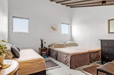 two beds in a room with white walls and windows at JB358-Brovst-Strandvejen-150-Lejl-126 in Brovst
