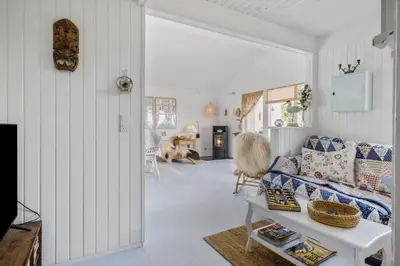 a living room with a couch and a table at JB401-Brovst-Solsortevej-1 in Brovst