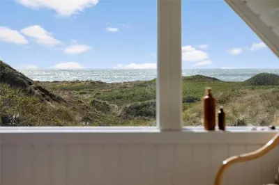 a window with a view of the ocean at 850-Thisted-Sandvej-19 in Thisted