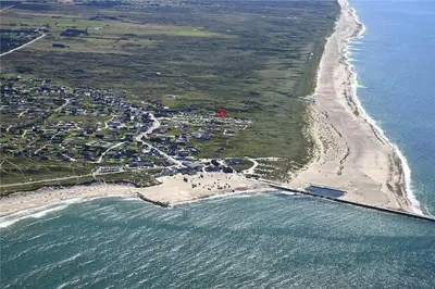 an aerial view of a beach and the ocean at 850-Thisted-Sandvej-19 in Thisted
