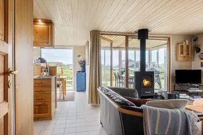 a living room with a couch and a fireplace at G228-Lemvig-Myntevej-28 in Lemvig