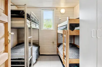 a small bedroom with bunk beds in a tiny house at G228-Lemvig-Myntevej-28 in Lemvig