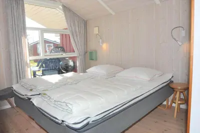 a large bed in a room with a window at 80153-Vemb-Knudehus-49 in Vemb