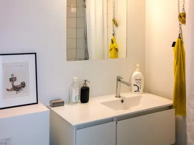 a bathroom with a sink and a mirror at Family-Friendly House with Sauna in Pandrup