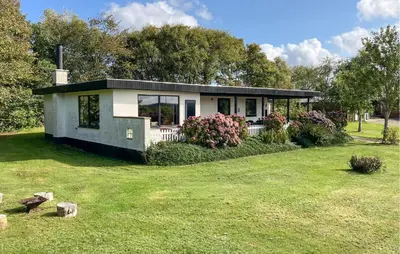 a small house in a field with a yard at Pet Friendly Home In Struer With Wifi in Struer