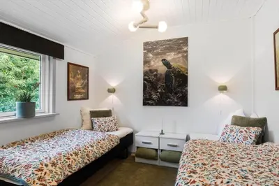 a bedroom with two beds and a window at JB162-Fjerritslev-Ronnevej-4 in Fjerritslev