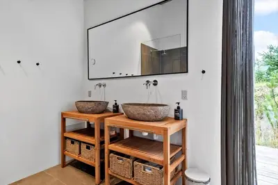 two sinks in a bathroom with a mirror at LK2174-Lokken-Stellavej-18 in Løkken