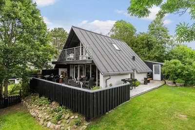 a house with a black roof at LF15103-Farso-Rorsangervej-3 in Farsø
