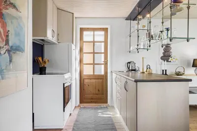 a kitchen with a white refrigerator and a door at LF21632-Spottrup-Rylevej-1 in Spottrup