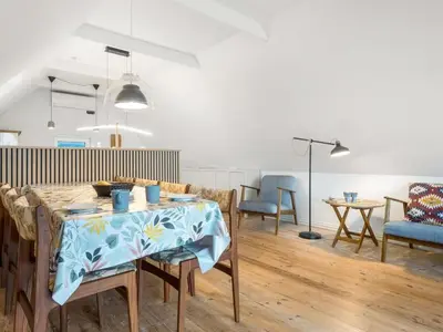 a living room with a table with a blue table cloth at Holiday Home Raika - 25m to the fjord by Interhome in Vestervig