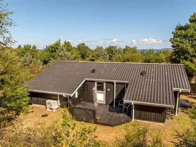 a house with solar panels on the roof at Holiday Home Marisol - 250m to the fjord by Interhome in Fur