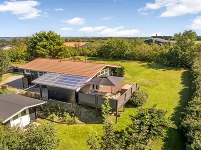 an aerial view of a house with solar panels on the roof at Holiday Home Berner - 500m to the fjord by Interhome in Roslev