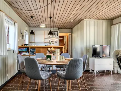 a dining room with a table and chairs at Apartment Enwald - 700m from the sea by Interhome in Pandrup