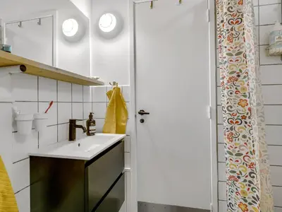 a bathroom with a sink and a shower at Holiday Home Ingobert - 600m from the sea by Interhome in Saltum