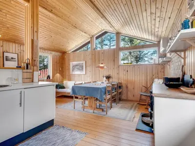 a kitchen and dining room with a table in a house at Holiday Home Ingobert - 600m from the sea by Interhome in Saltum