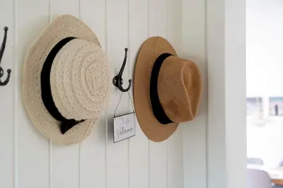 two straw hats are hanging on a wall at 1357-Snedsted-Grahavrevej-1 in Snedsted