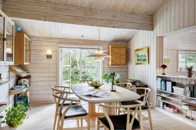 a dining room with a table and chairs at BL1121-Saltum-Daadyrvej-7 in Saltum