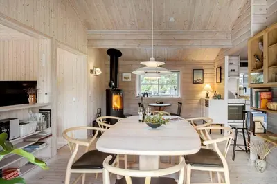 a dining room with a table and chairs at BL1121-Saltum-Daadyrvej-7 in Saltum