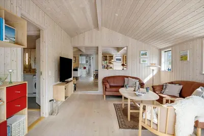 a living room with a couch and a table at BL1121-Saltum-Daadyrvej-7 in Saltum