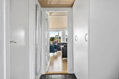 a hallway leading to a living room with white walls at JB367-Brovst-Kronvildtvej-102 in Brovst