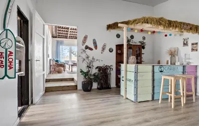 a room with a kitchen with a table and a counter at Awesome Home In Harboøre With Sauna in Harboør