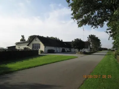 a house on the side of a road at Bakkegården Homestay in Spottrup