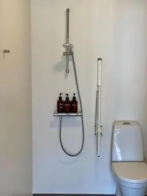 a bathroom with a shower and a toilet at Staarup Hovedgaard in Højslev