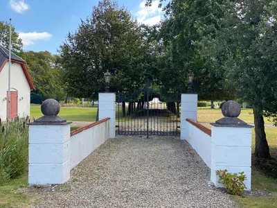 an entrance to a gate with a fence at Staarup Hovedgaard in Højslev