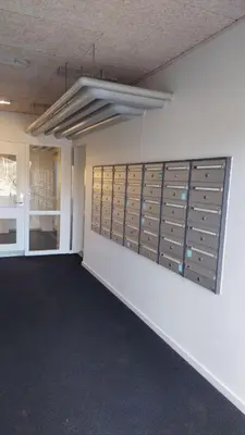 a room with a bunch of lockers on a wall at Antonia s quality apartment 1 in Viborg