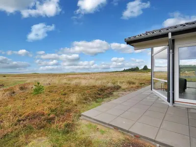 a building with a view of a field at Holiday Home Arisa - 100m to the fjord by Interhome in Løgstør