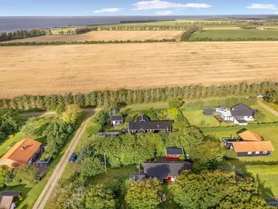 an aerial view of a farm with houses and a field at Holiday Home Elea - 450m to the fjord by Interhome in Vemb