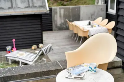 a patio with chairs and a table and a table and chairs at BL1120-Saltum-Kohlsvej-15 in Saltum
