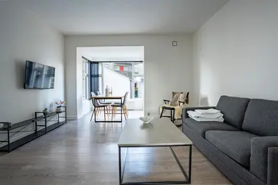 a living room with a couch and a table at Holstebro Apartments in Holstebro