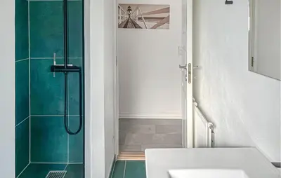 a bathroom with a shower and a sink at 3 Bedroom Nice Home In Blokhus in Blokhus