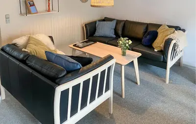 a living room with a couch and a table at Pet Friendly Home In Vestervig With Sauna in Vestervig