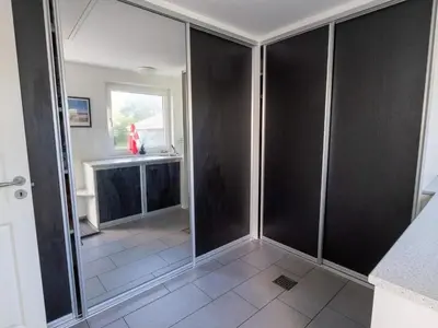 a bathroom with black walls and a sink at 4 star holiday home in Hanstholm in Hanstholm