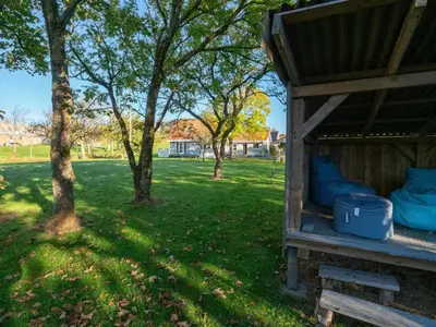 a outhouse in a park with trees and grass at 4 star holiday home in Hanstholm in Hanstholm