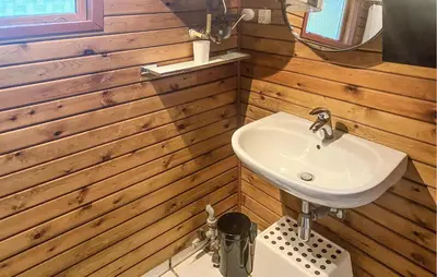 a bathroom with a sink and a mirror at 3 Bedroom Awesome Home In Højslev in Højslev