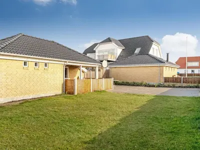a house with a fence in a yard at Holiday Home Gisa - 500m from the sea by Interhome in Thisted