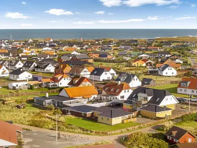 an aerial view of a town with houses and the ocean at Holiday Home Gisa - 500m from the sea by Interhome in Thisted